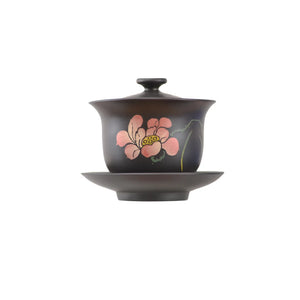 Jianshui zitao Gaiwan tea bowl with hand-carved lotus flower design, shown with matching saucer