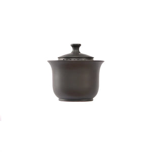 Handmade pottery black Gaiwan tea bowl with fitted lid featuring a built-in vent hole.