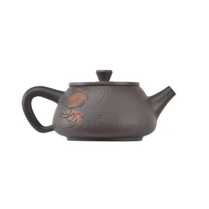 Alternate side view of clay teapot No.14 with hammered texture and cloud motif