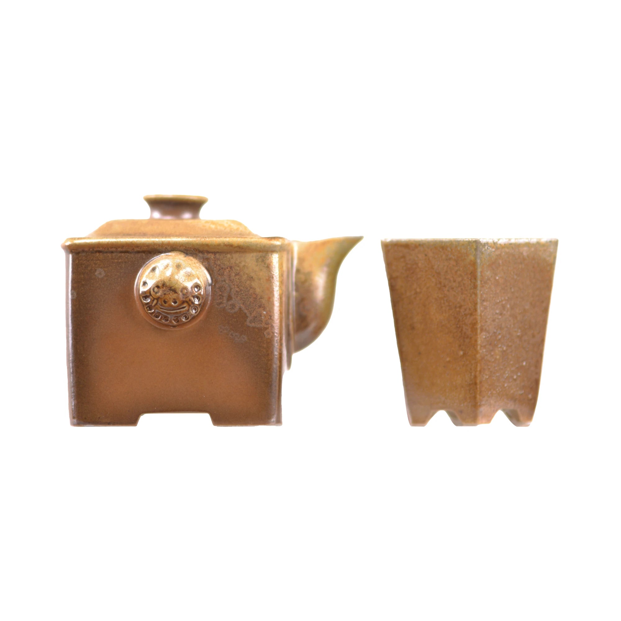 Side view of a wood-fired pottery square hand-grip teapot set with matching cup