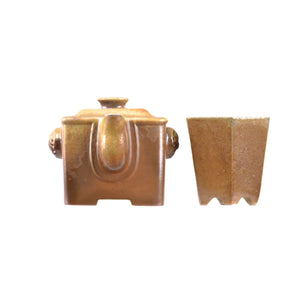 Detail view of a wood-fired Jianshui zitao square teapot and cup set showing naturally formed kiln-fired textures