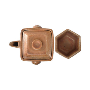 Top view of a wood-fired jianshui zitao square teapot and cup set with natural ash glaze texture
