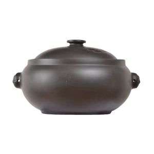 Back view of a Jianshui zitao pottery steam pot with a smooth rounded body and fitted lid
