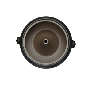 Interior top view of a Jianshui zitao pottery steam pot with central steam hole