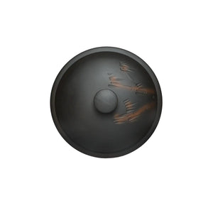 Top view of a Jianshui zitao (black) tea canister with hand-carved bamboo design on the lid