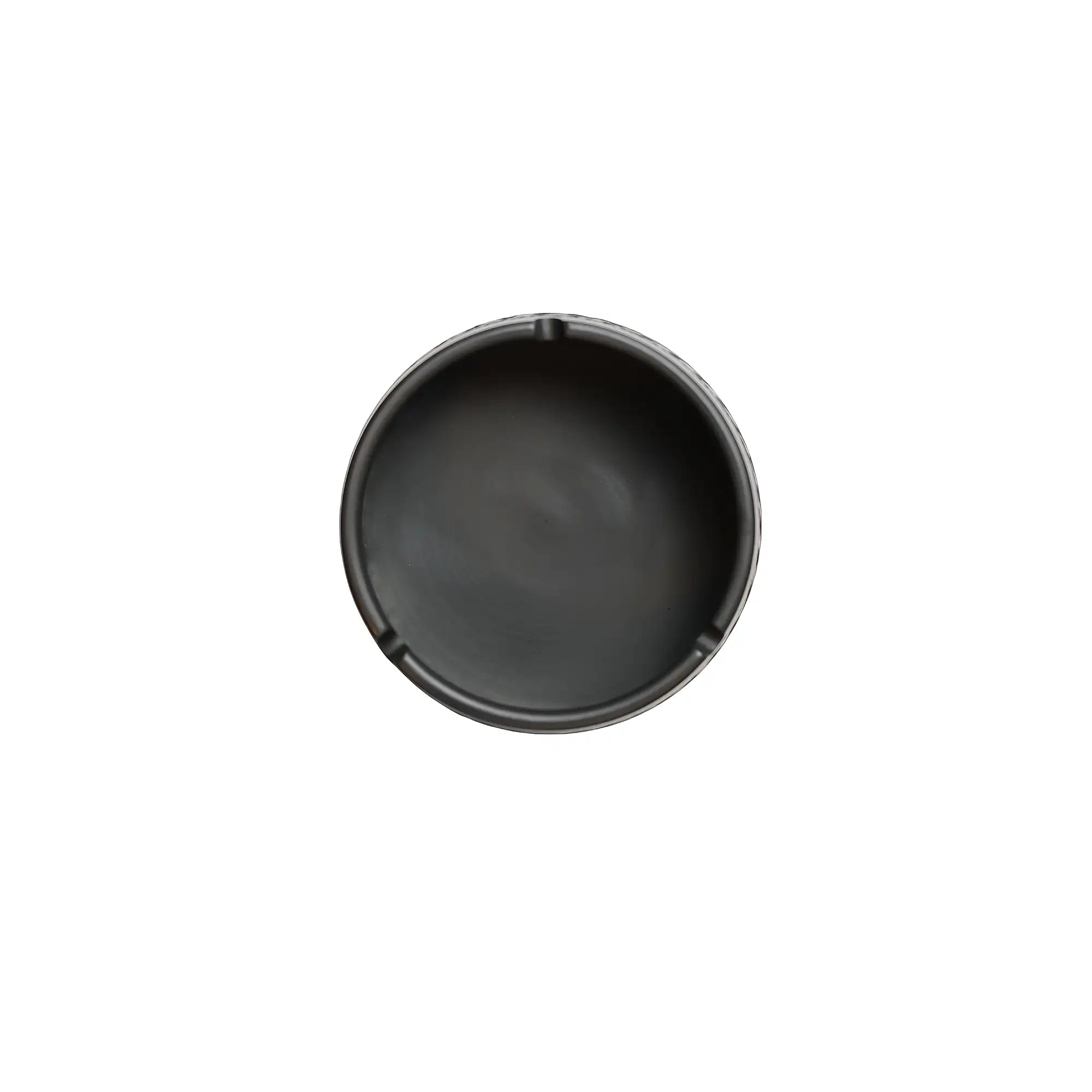 Top view of a jianshui zitao ashtray with a smooth matte interior and cigarette rests.