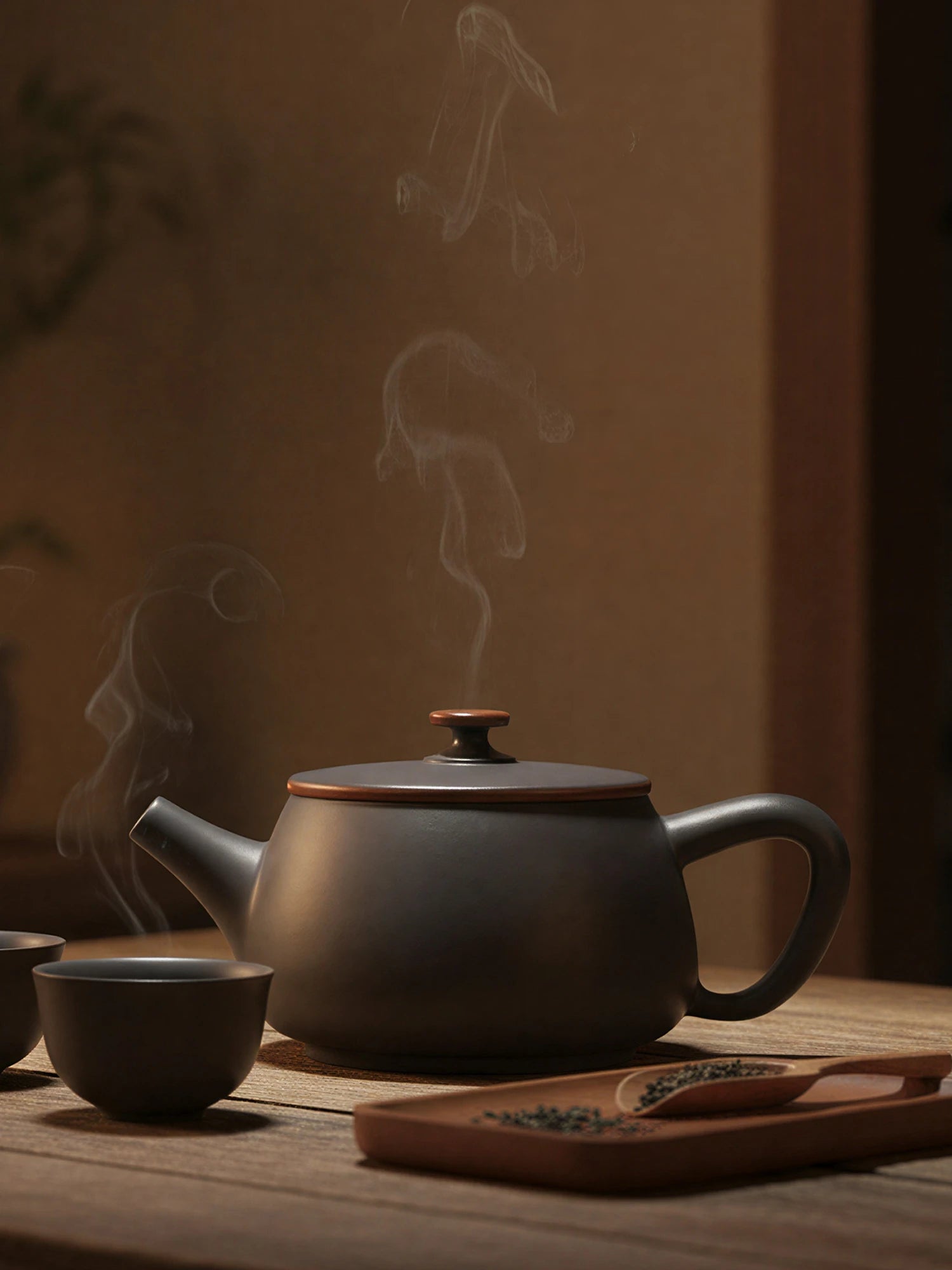 Traditional Jianshui zitao teapot set presented on a wooden tea table