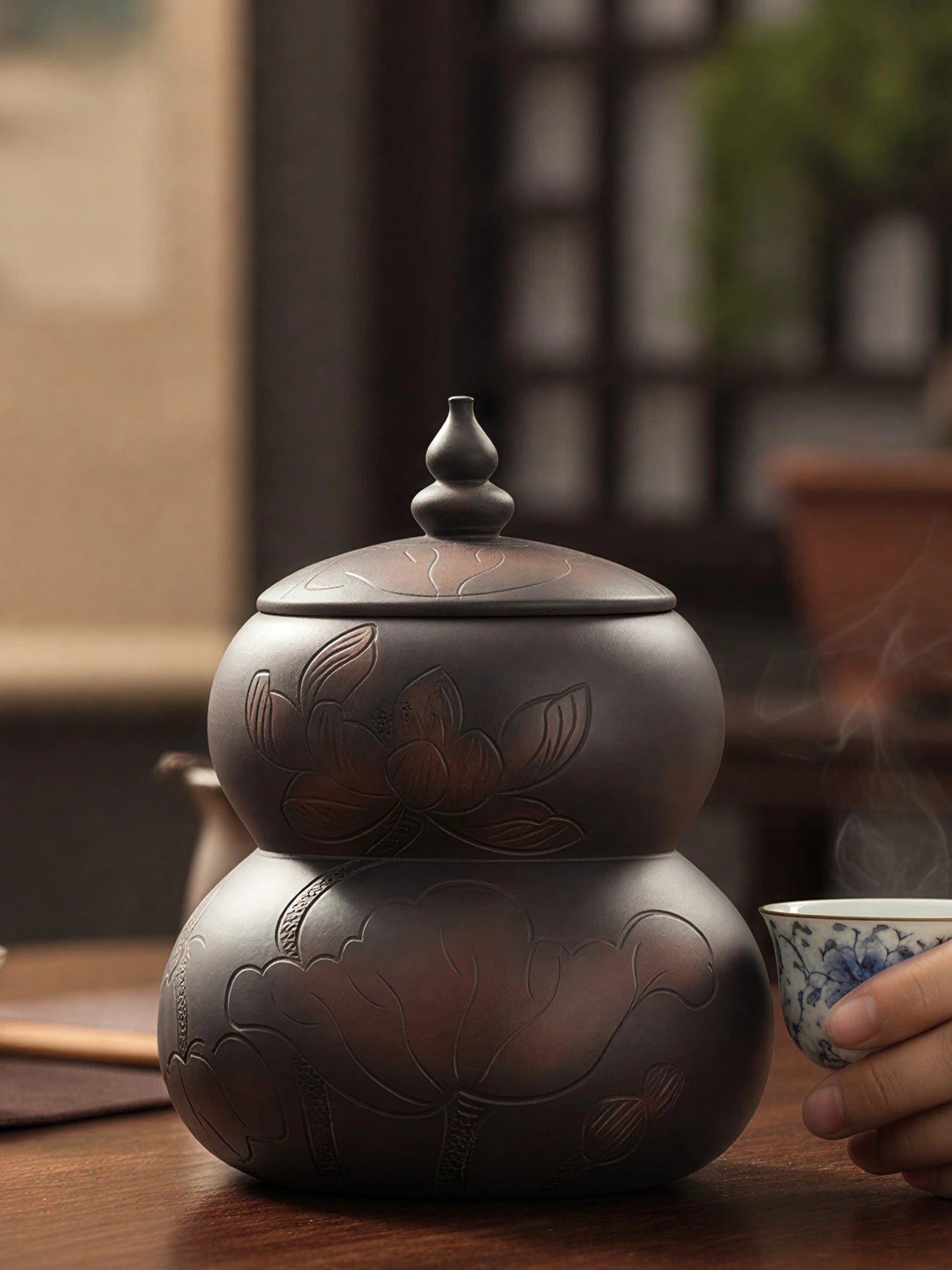 Jianshui zitao tea canister showcasing handcrafted form and subtle carved decoration