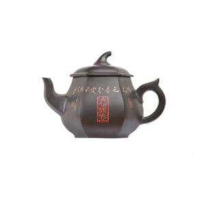 No.56 hexagonal clay teapot featuring carved Chinese calligraphy with red seal stamp