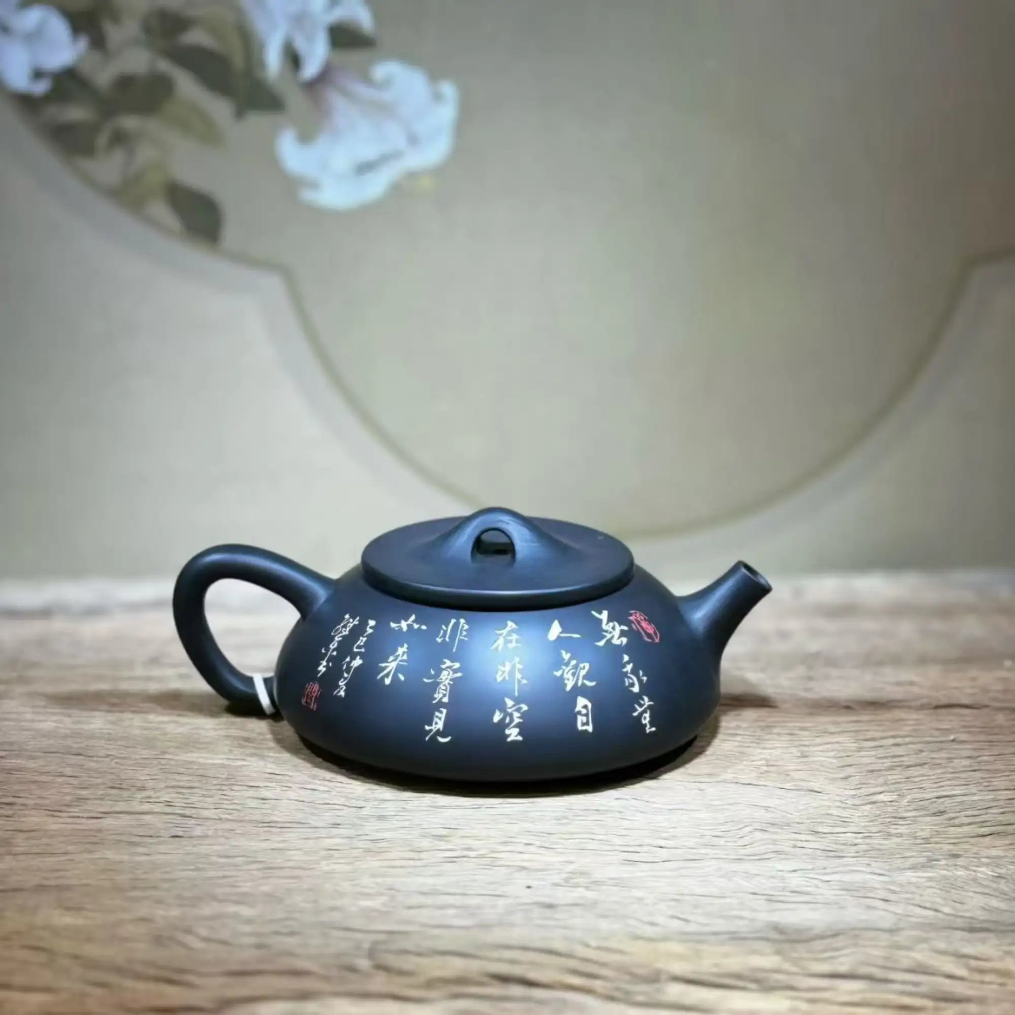 Handcrafted clay teapot with traditional Yin-carved and Yang-filled design, unglazed purple clay teaware