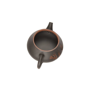 Open view of clay teapot No.4 showing natural clay interior and pouring structure