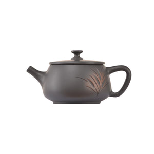Side view of clay teapot No.8 with hand-carved bamboo motif and traditional form