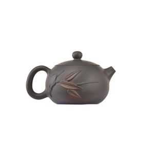 Side view of clay teapot No.16 showing raised bamboo relief design