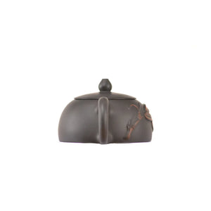 Back view of clay teapot No.17 featuring bamboo relief detailing and handcrafted texture