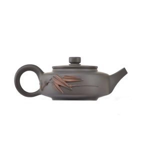 Side view of clay teapot No.18 showing raised bamboo relief design