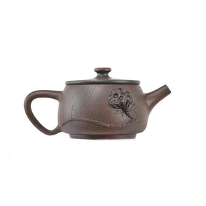 Side view of clay teapot No.22 showing Bodhi pattern texture and lotus pod relief design