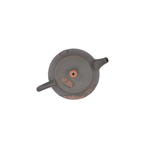 Top view of clay teapot No.23 highlighting lid shape and peony relief detail