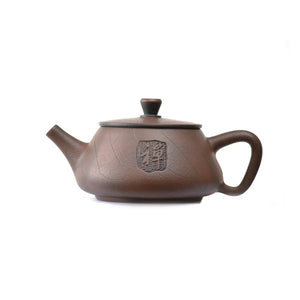 Side view of handcrafted clay teapot No.24 featuring traditional calligraphy carving