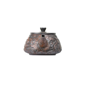 Front view of clay teapot No.32 showcasing detailed dragon and phoenix carving