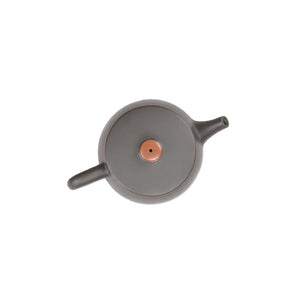 Top view of clay teapot highlighting lid shape and hand-polished surface