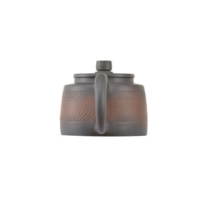 Back view of handcrafted clay teapot No.11 featuring natural textured surface