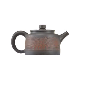 Alternate side view of clay teapot No.11 with textured jumping knife pattern