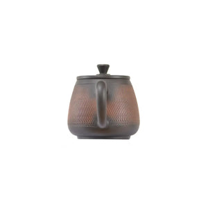Back view of handcrafted clay teapot No.12 featuring natural textured surface