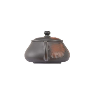 Back view of handcrafted clay teapot No.5 with hand-carved lotus motif surface