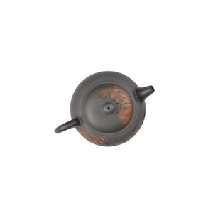 Top view of clay teapot No.5 highlighting lid shape and lotus carved design