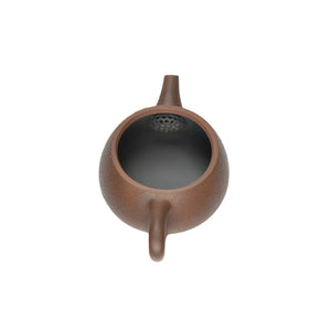 Open view of clay teapot No.10 showing natural clay interior and pouring structure
