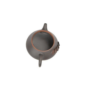 Open view of clay teapot No.15 showing natural clay interior and pouring structure