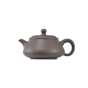 Side view of clay teapot No.15 with smooth uncarved surface and traditional form