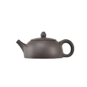 Side view of clay teapot No.17 with smooth uncarved surface and traditional form