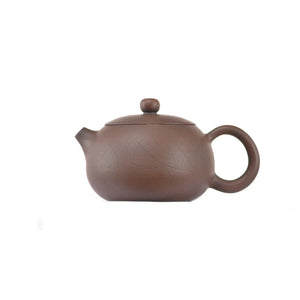 Side view of clay teapot No.21 with smooth uncarved surface and traditional rounded form