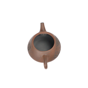 Open view of clay teapot No.24 showing natural clay interior and pouring structure