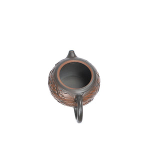 Open view of handcrafted clay teapot No.31 showing natural clay interior