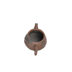 Interior view of PorSva No.34 Shipiao clay teapot displaying natural clay surface and pouring structure