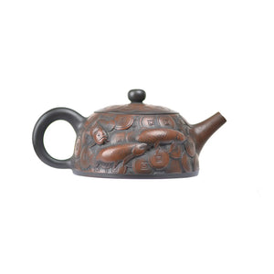 Right side view of PorSva No.35 clay teapot showing continuous relief design