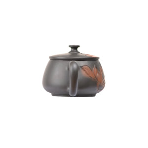 Back view of PorSva No.39 Hanwa lotus carved clay teapot showing clean clay texture