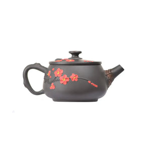 Right side view of PorSva No.43 Hanwa clay teapot highlighting plum blossom motif and root-inspired form