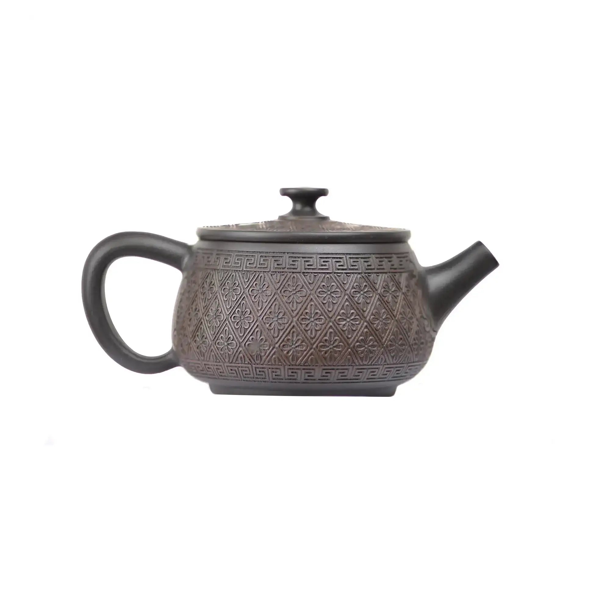 Right side view of PorSva No.38 Hanwa machine-carved pattern clay teapot showing structured architectural form