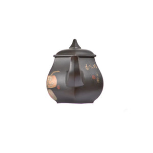 Front view of PorSva No.56 hexagonal clay teapot featuring plant and floral carving with clay inlay