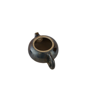 Interior view of PorSva No.60 wood-fired clay teapot showing natural unglazed interior
