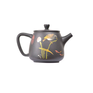 Side view of clay teapot No.25 showing yin-carved flora and fauna design