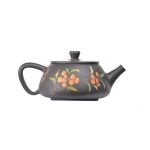 Side view of clay teapot No.27 showing persimmon inlay design