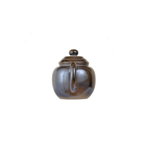Back view of PorSva No.65 wood-fired clay teapot showing natural firing variations