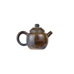 Right side view of PorSva No.65 wood-fired Jianshui clay teapot highlighting kiln-fired surface texture