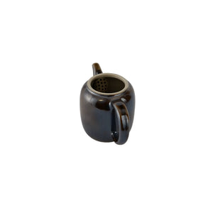 Interior view of PorSva No.66 wood-fired clay teapot showing natural unglazed interior
