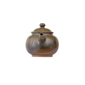 Front view of PorSva No.46 wood-fired clay teapot style 3 with natural kiln-fired surface