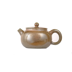 Left side view of PorSva No.47 wood-fired clay teapot showing natural kiln ash texture